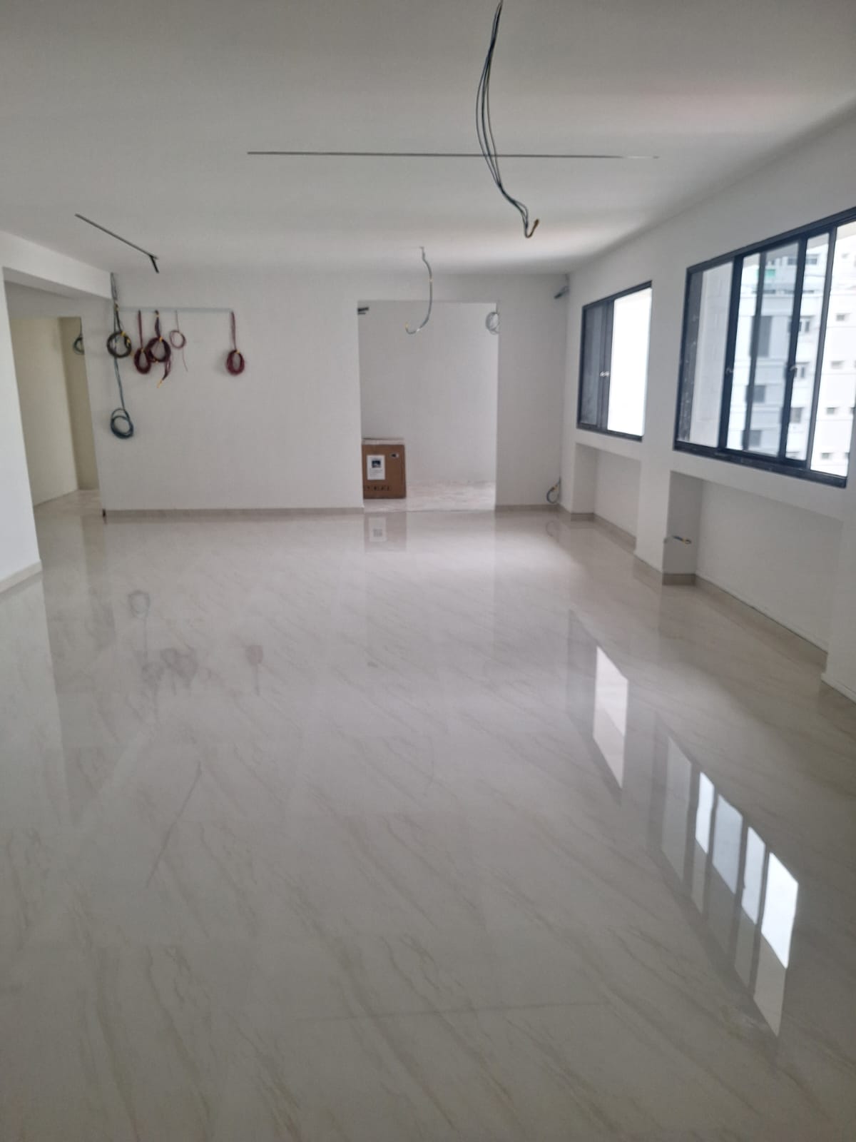 Large living room with a seamless, polished marble-look gum grout floor