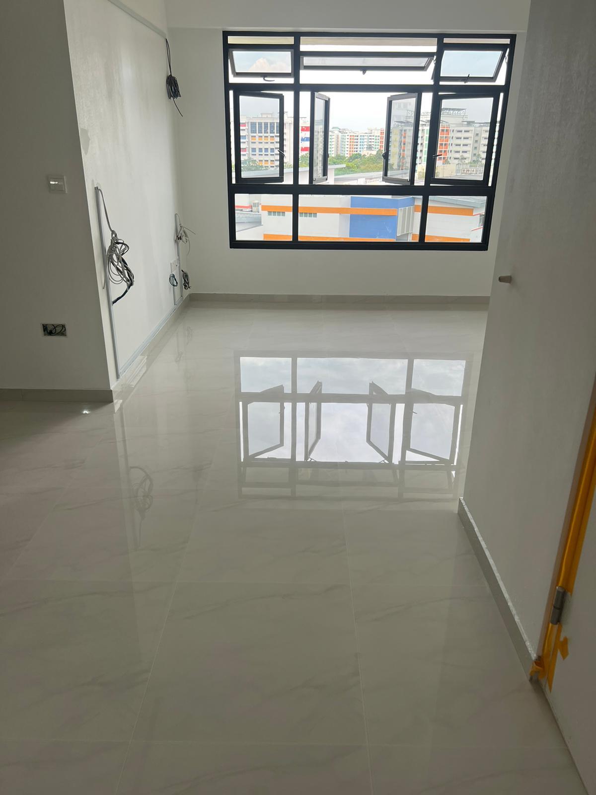 Glossy marble gum grout floor reflecting the window in a bright Singapore home