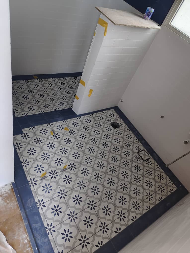 Close-up of patterned floor tiles with neat epoxy grout lines